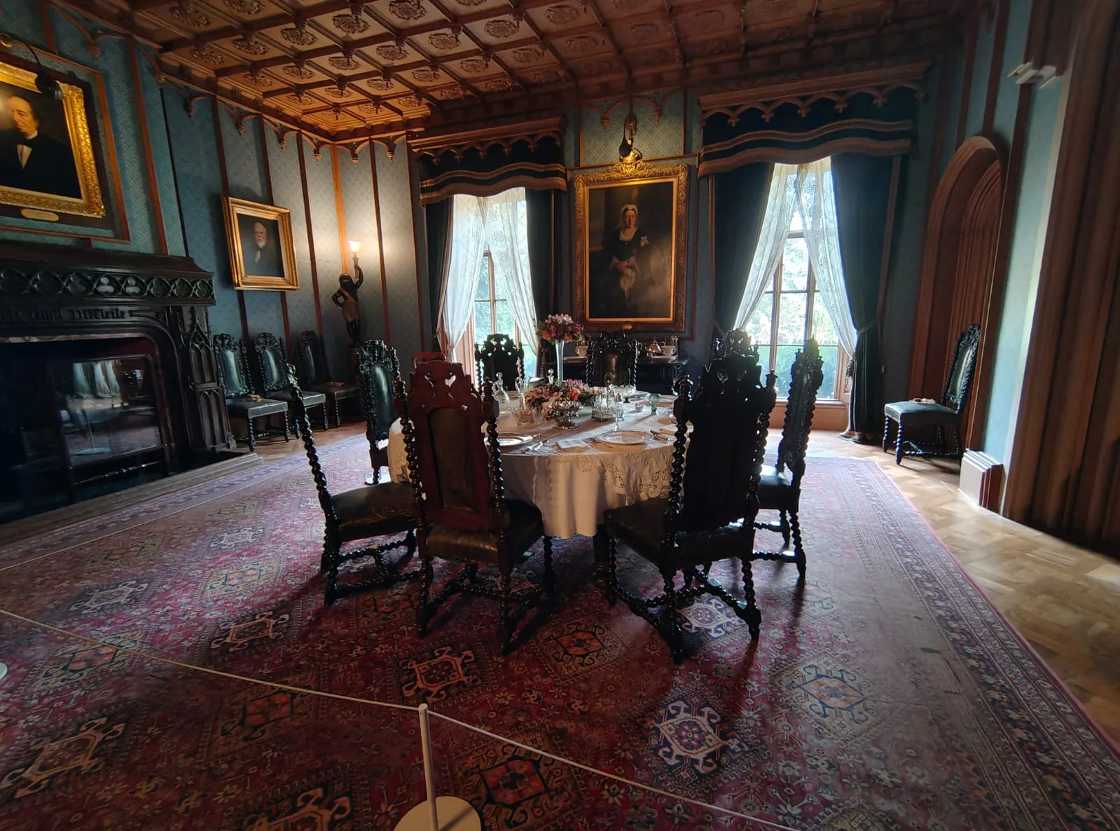 A large dining room with a round table