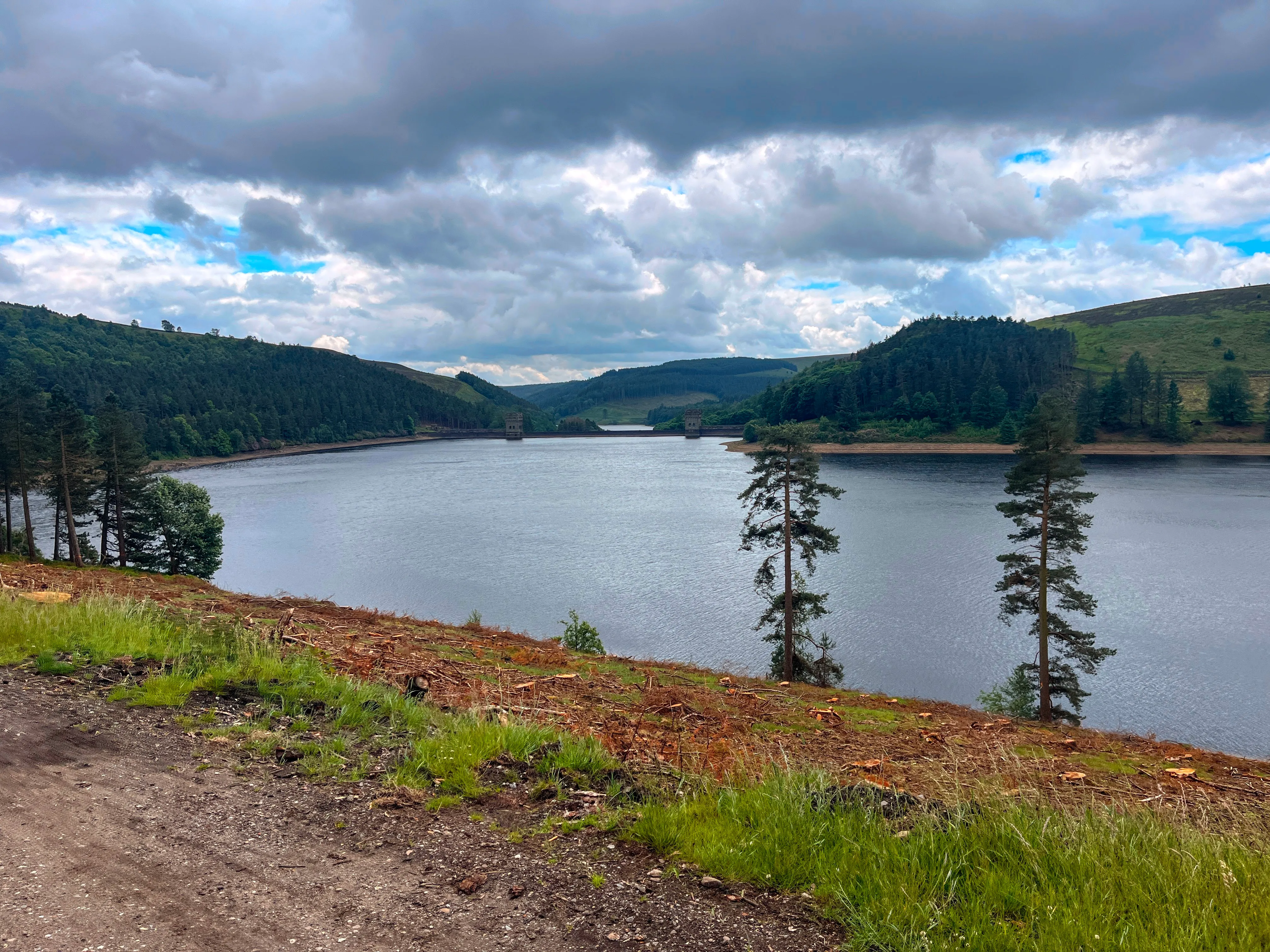 A photo of a large body of water with hills on either side