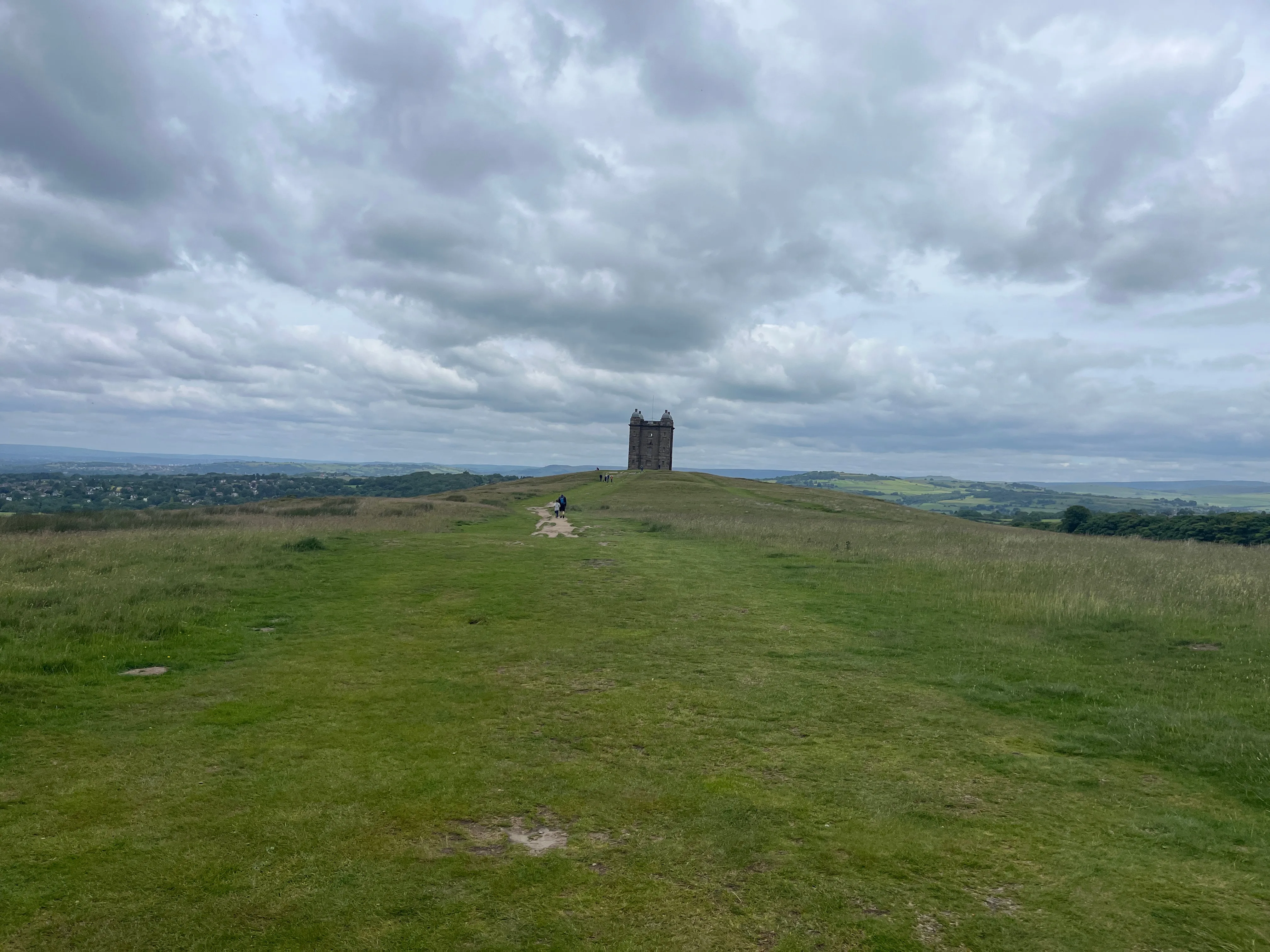 A small strone keep on the top of a hill