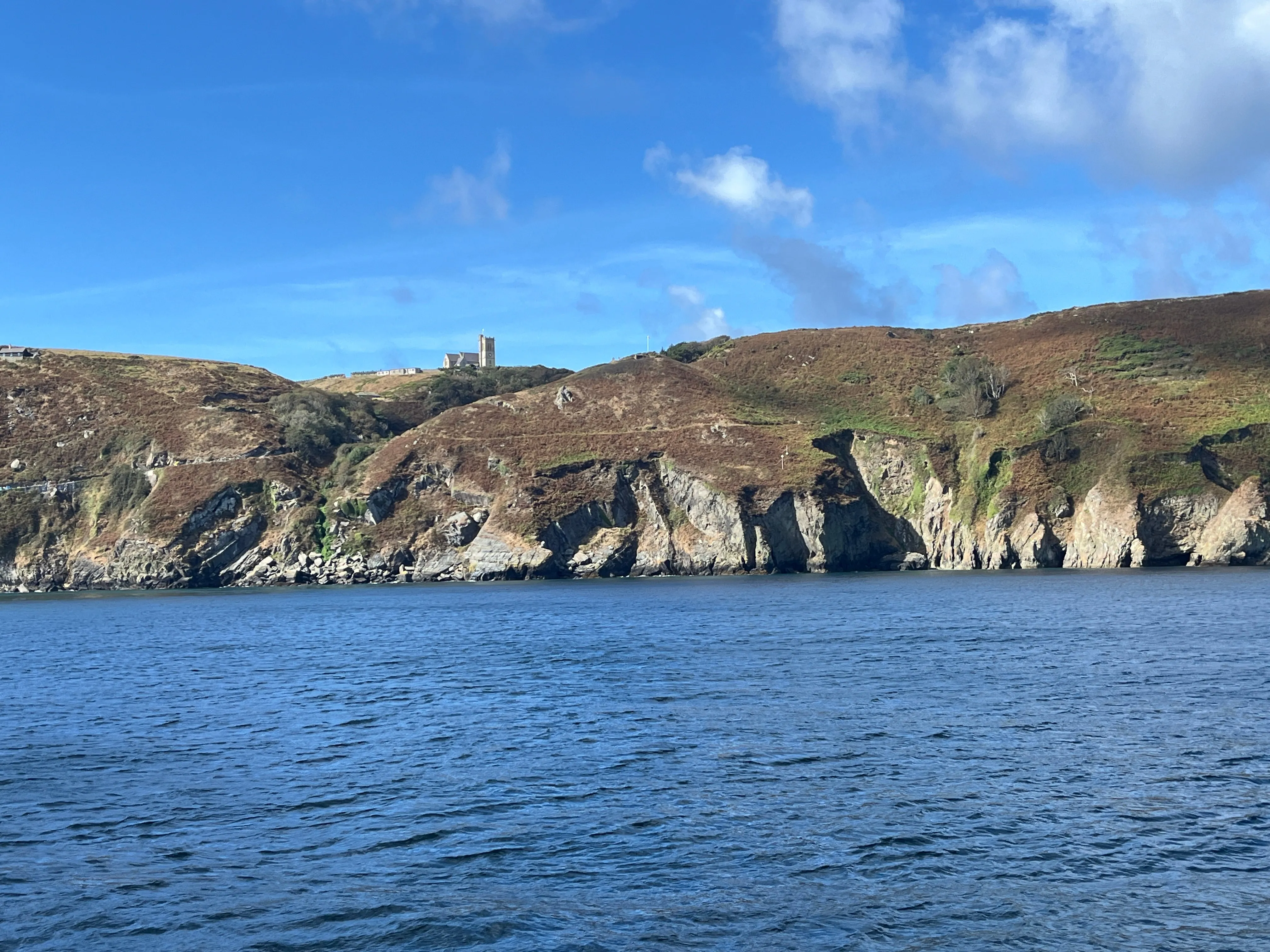 An island with a small village and church just visible