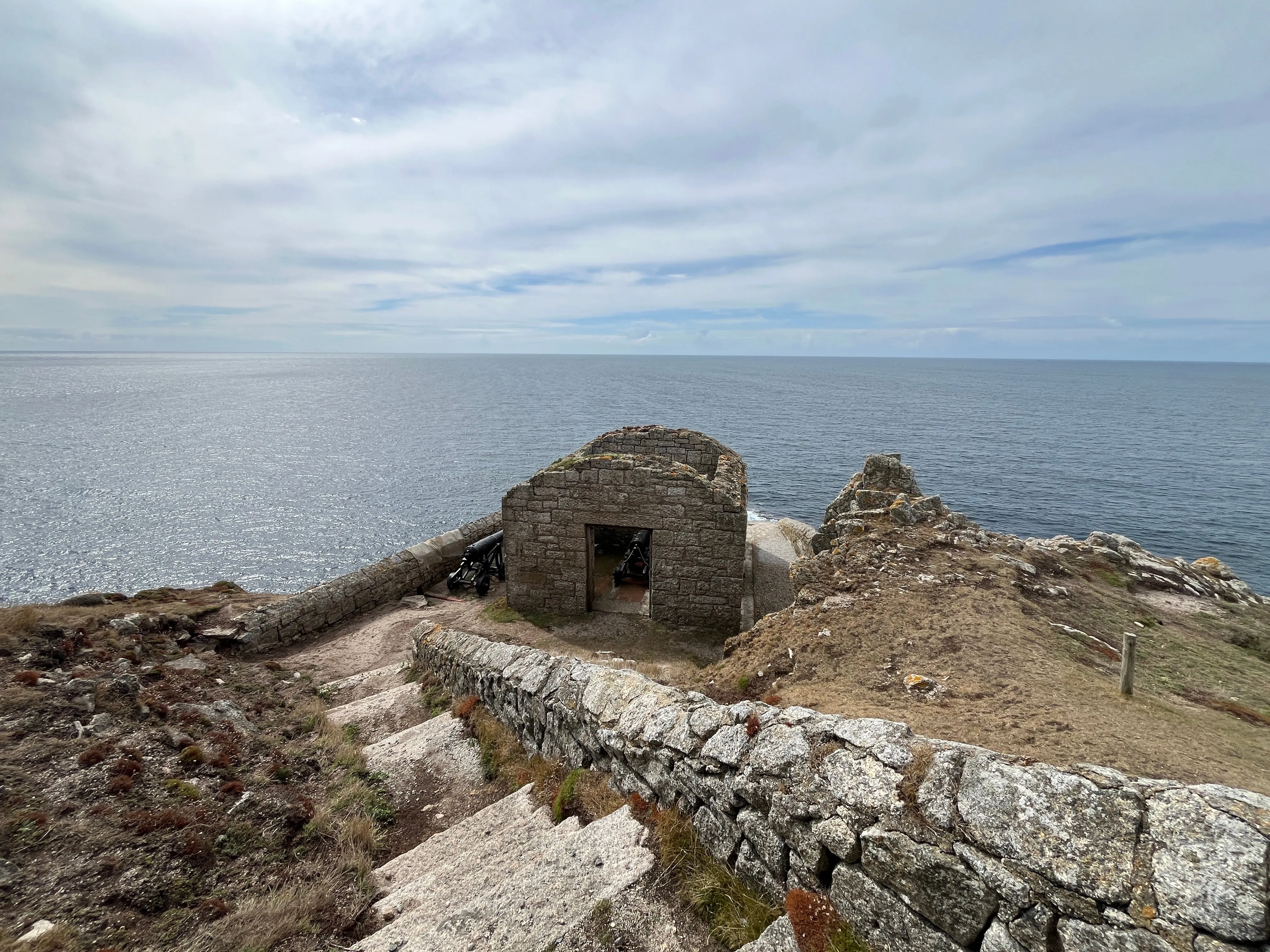 “A crumbling stone building with cannons inside”